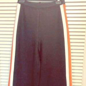 Black wide leg pants, orange/white stripe on side